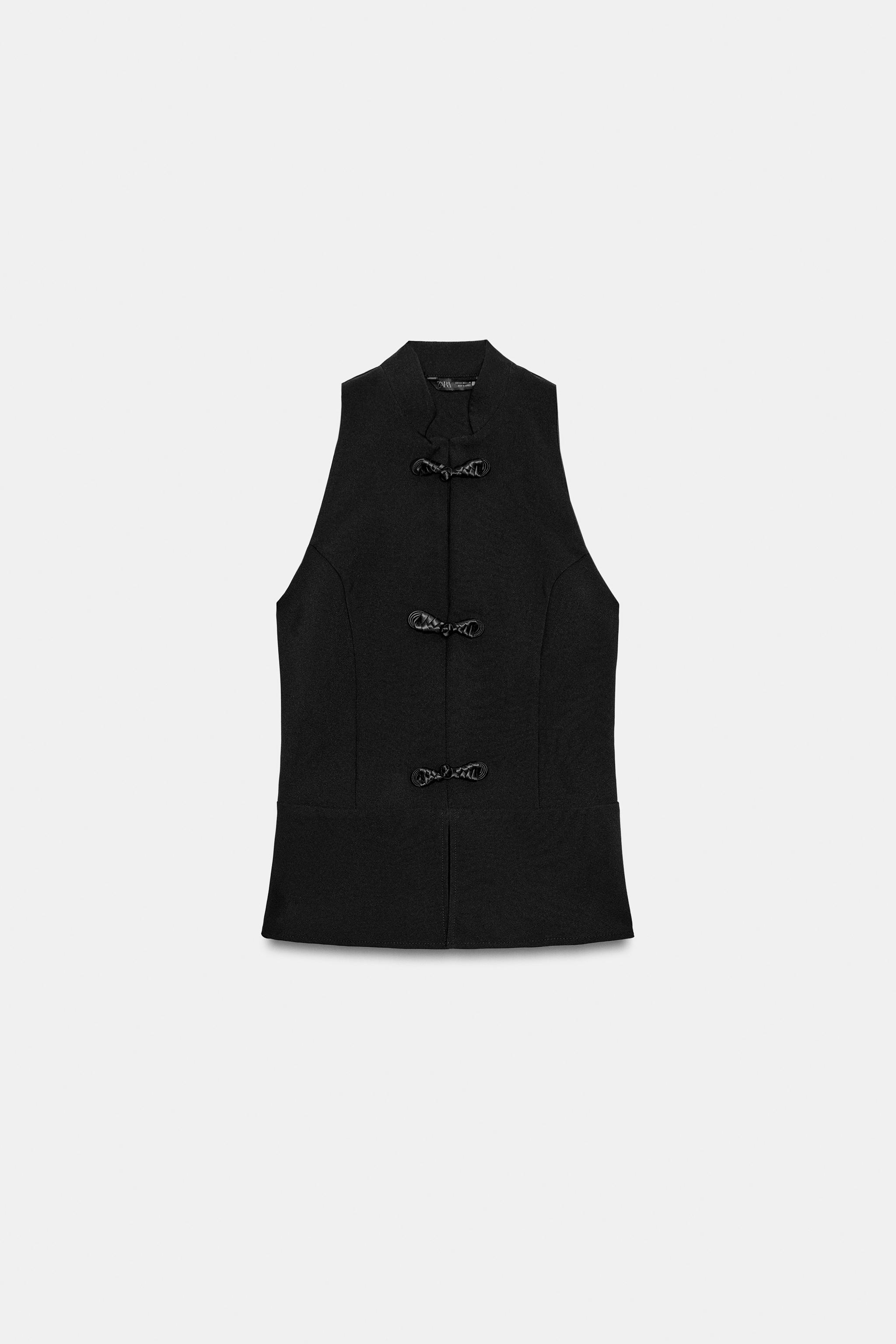 PEPLUM FROG CLASP TOP